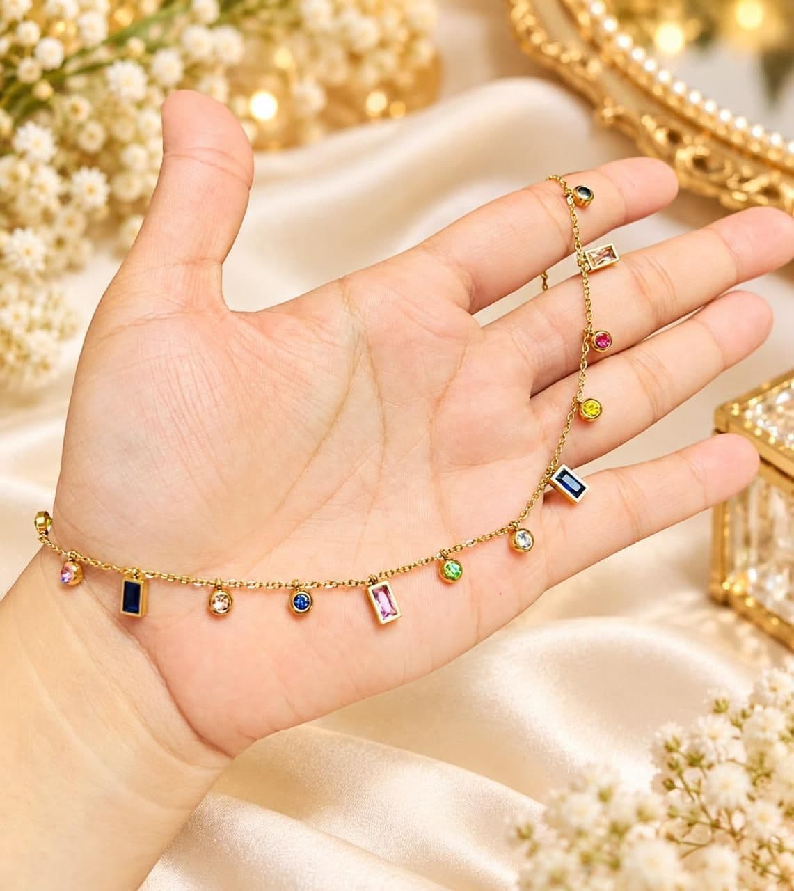 Gold bracelet with coloured gem drops
